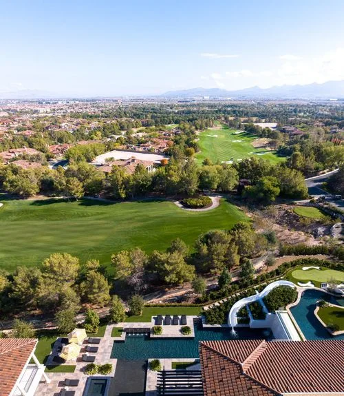 Aerial estate pool and adjacent golf course