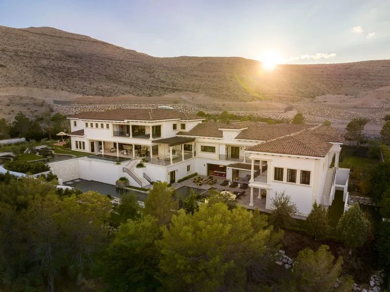 Aerial hillside estate and exterior landscape at sunset in La Quinta