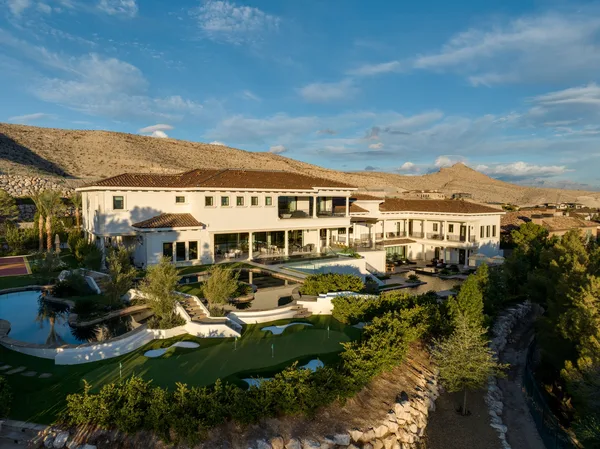 Aerial pool garden and hillside residence in La Quinta