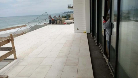 Aligned large format paving on oceanfront terrace