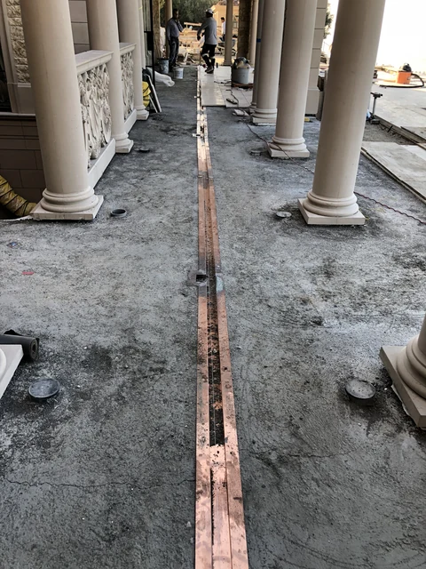 Before copper slot drain installation in terrace subbase