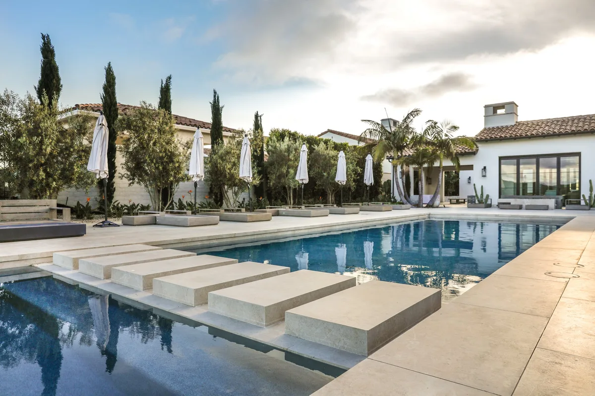 Broad pool entry steps and lounge terrace in Crystal Cove