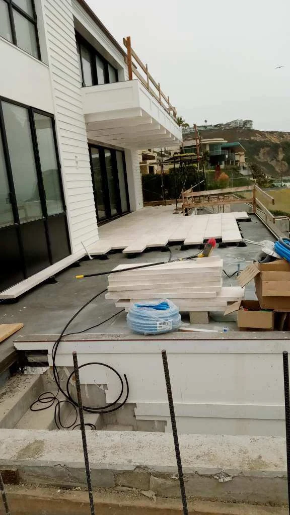 Coastal terrace paving installation in progress