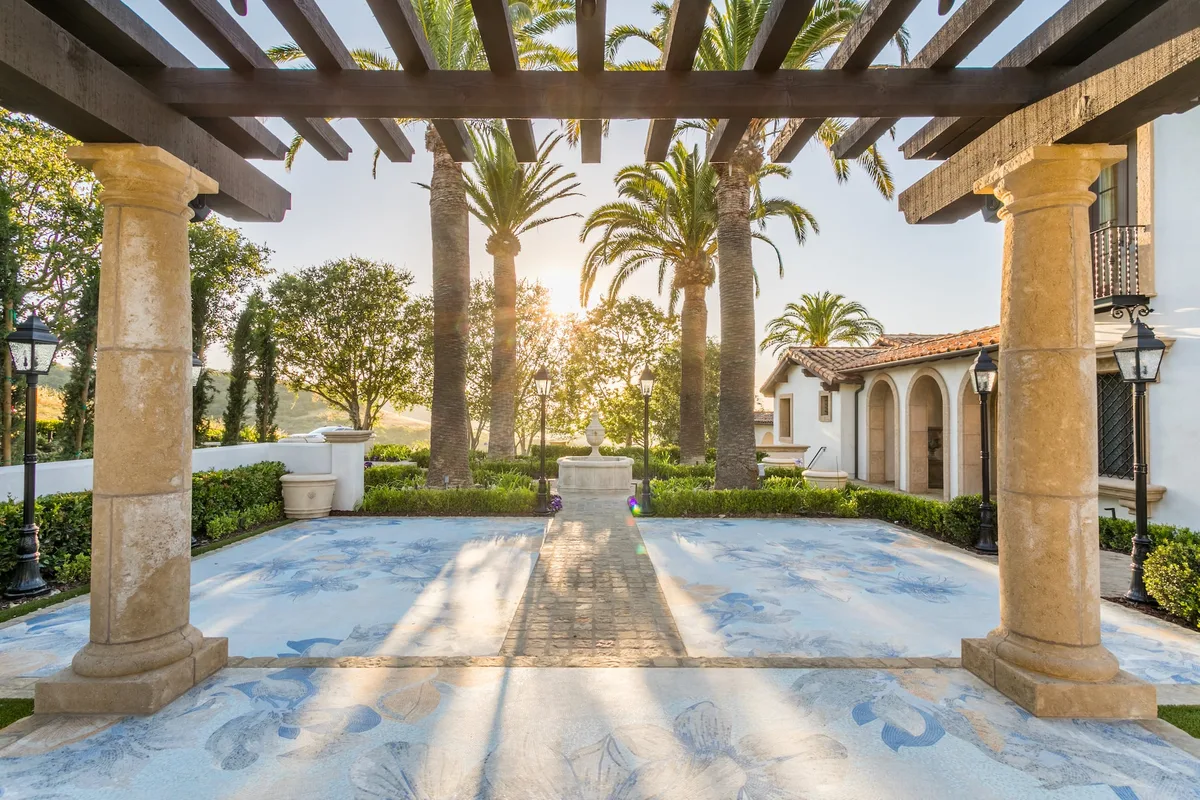Columned pergola and decorative mosaic courtyard paving in Irvine