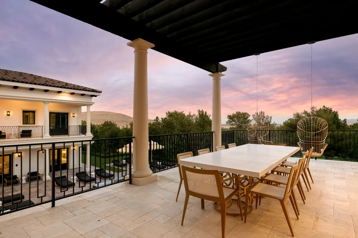 Covered balcony dining area at sunset in La Quinta