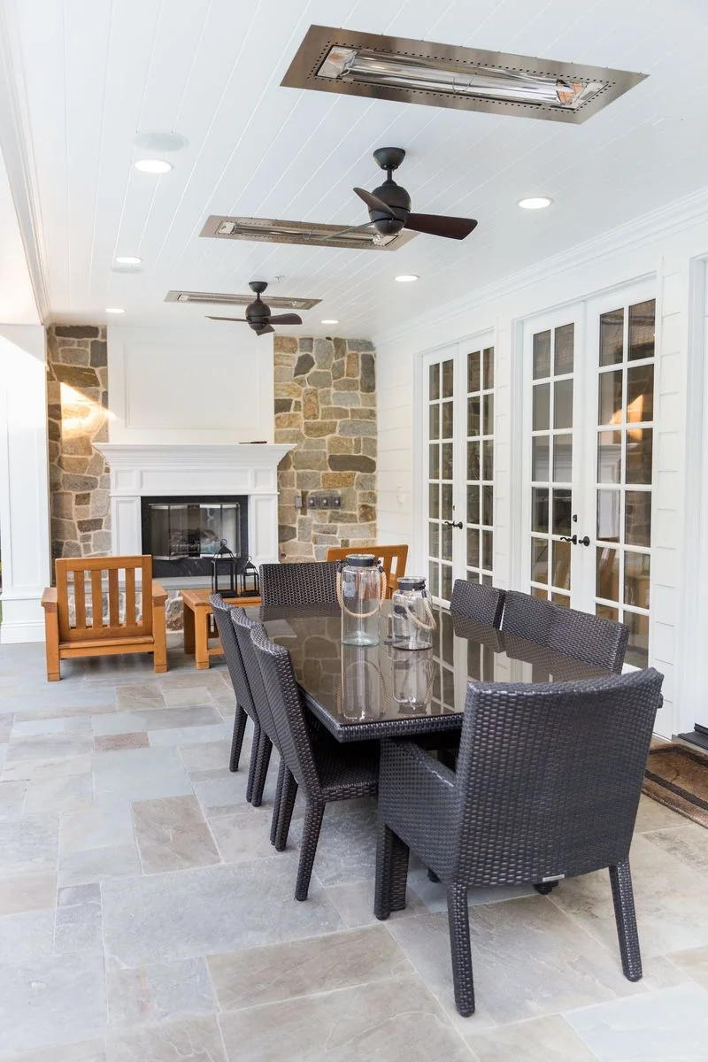 Covered patio dining room and stone fireplace