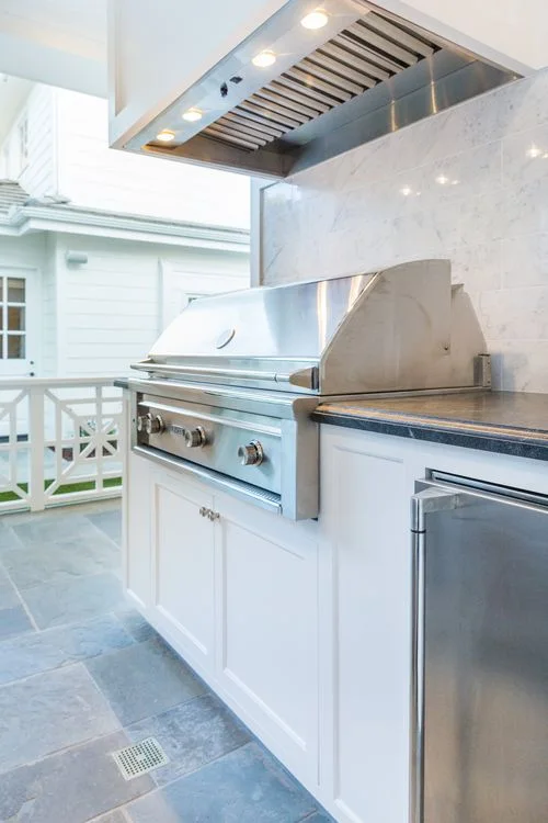 Covered pool house grill range hood and cabinetry