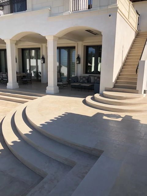 Curved stone entrance steps and terrace