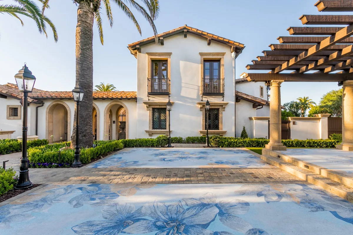 Decorative mosaic courtyard between residence and pergola in Irvine
