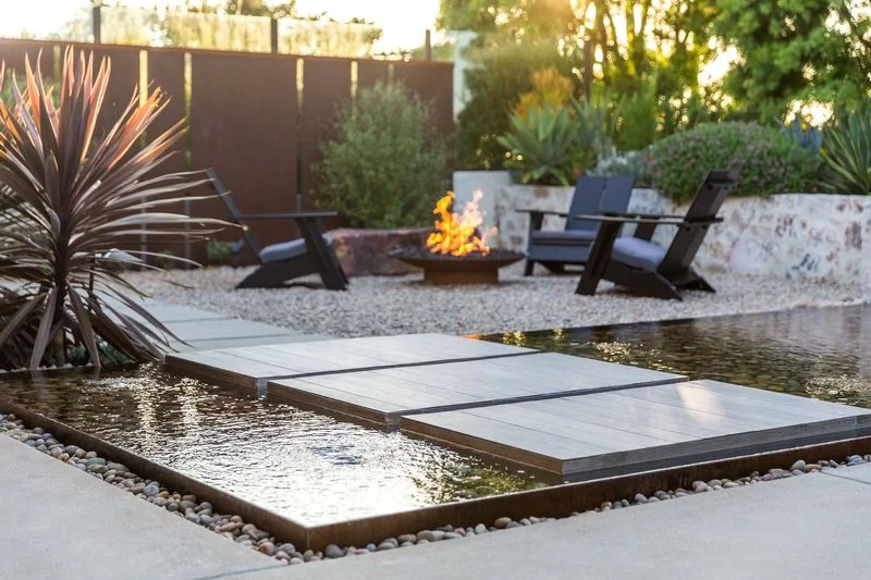 Floating stepping pads leading to garden fire bowl