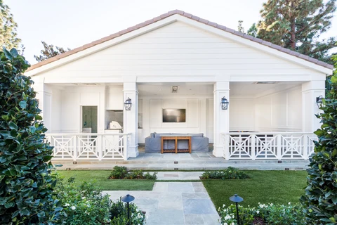 Gabled white pool house and garden approach
