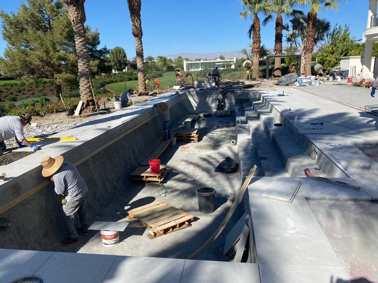 Linear shotcrete steps replacing original curved pool entry