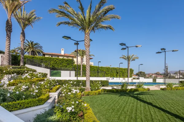 Palm garden lawn and terraced flowering beds in Pelican Hill
