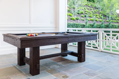 Pool house billiards table opening to garden