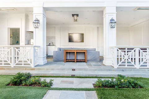 Pool house covered living room facing lawn