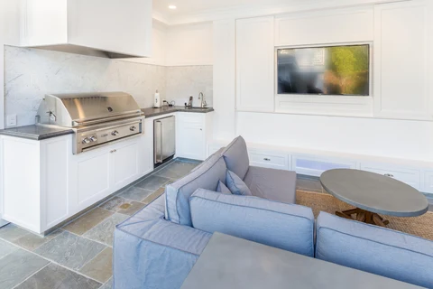 Pool house kitchen and lounge seating