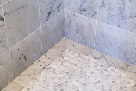 Pool house shower tile and mosaic floor detail