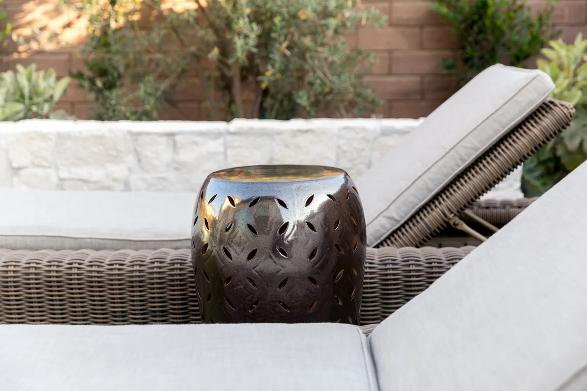Poolside chaise lounges and decorative side table
