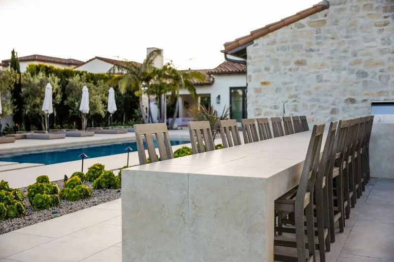 Poolside outdoor dining counter and tall chairs in Crystal Cove