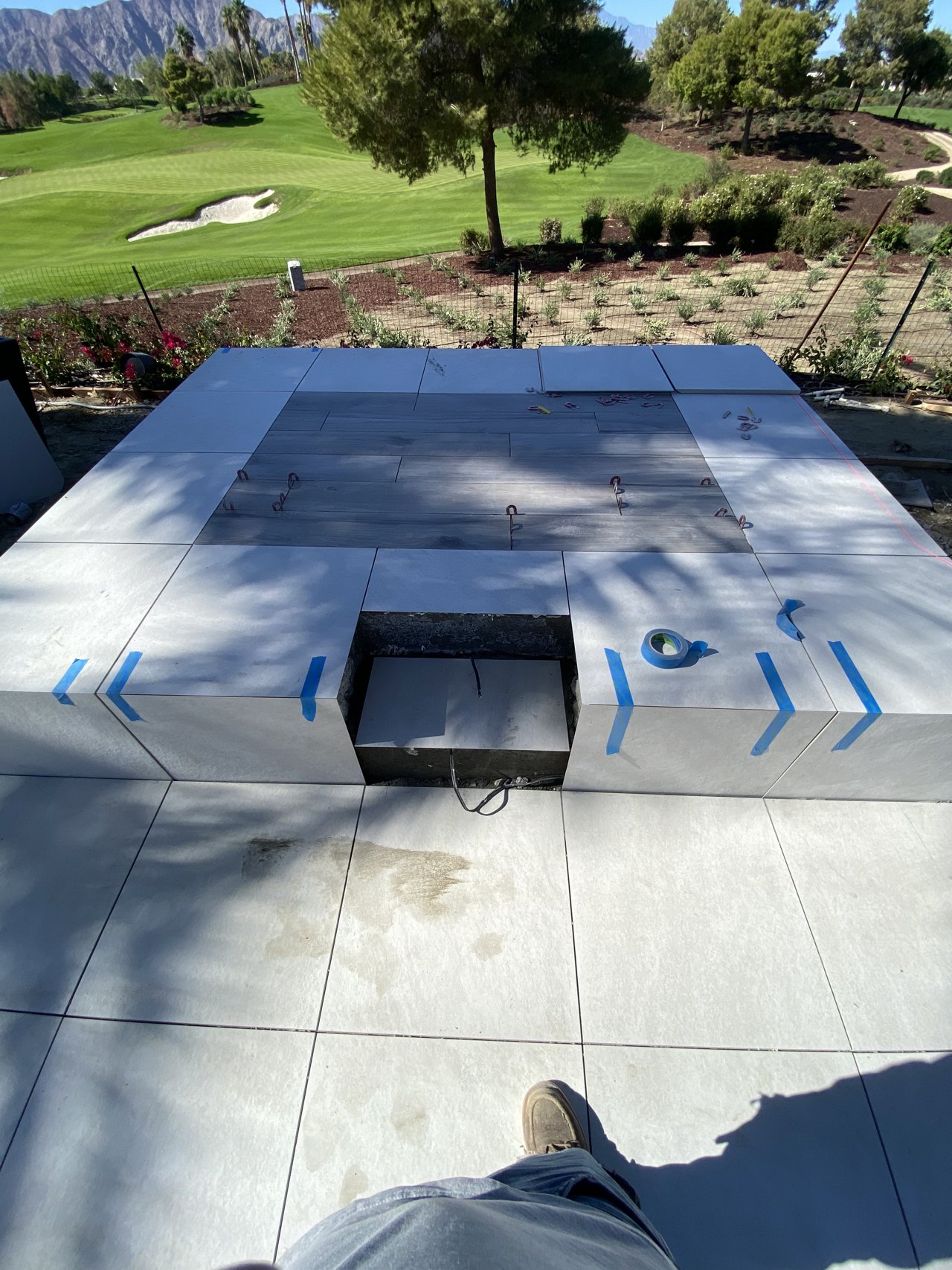 Precision tile layout on elevated seating pedestal