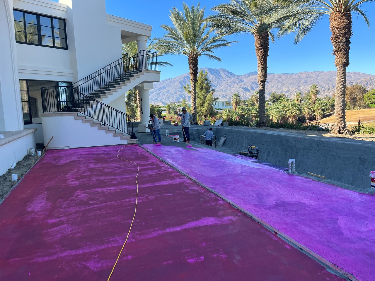RedGard membrane on concrete pool deck before tile