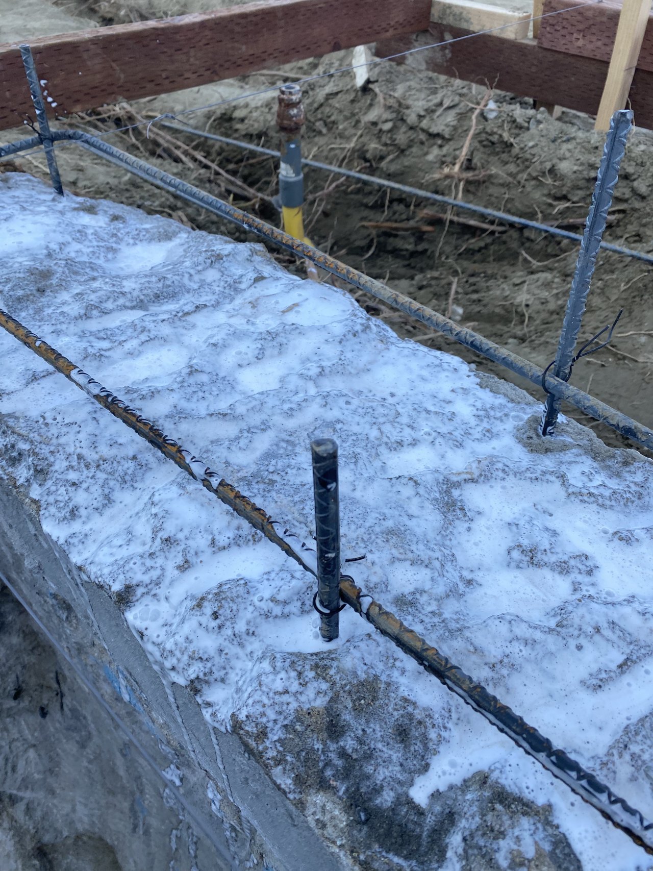 Reinforcing dowels anchored into existing pool concrete
