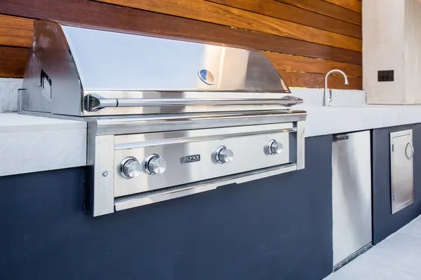 Stainless steel grill and sink in outdoor kitchen