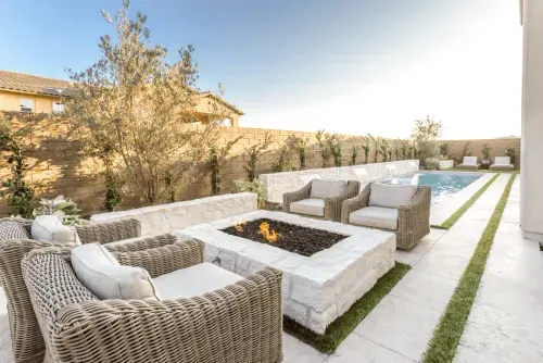 Stone fire pit and woven outdoor seating