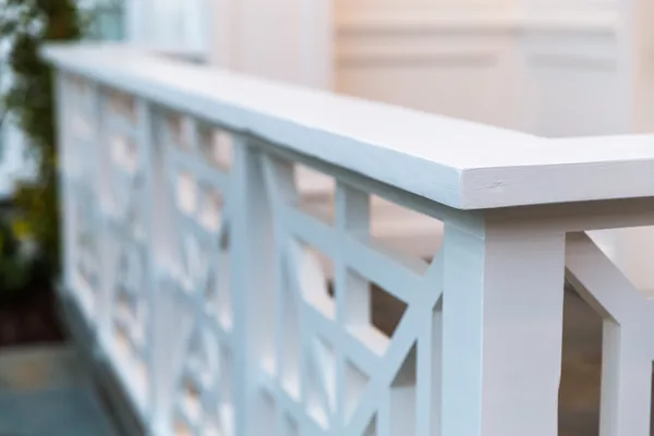 White geometric railing and smooth cap detail