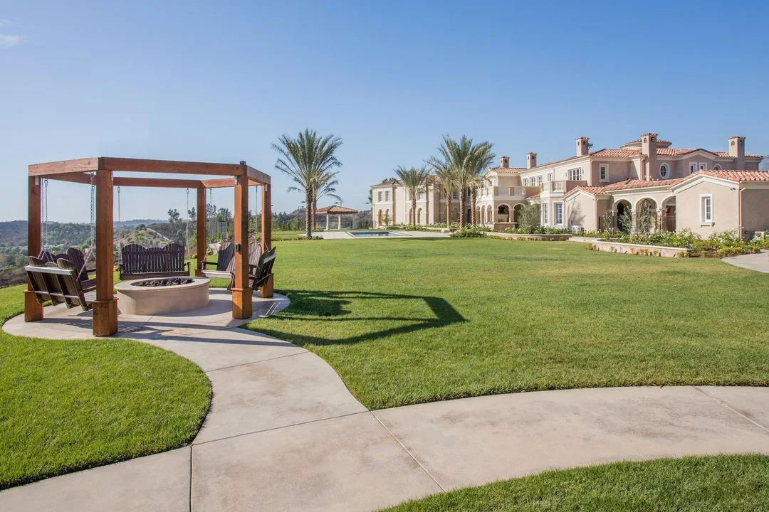 Large lawn with a freestanding timber seating structure